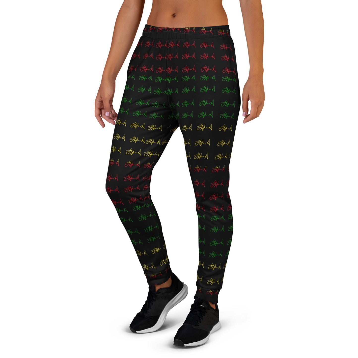 A person modeling black leggings with an all-over repeating pattern of small red, green, and yellow graffiti-style tags, shown against a plain white studio background. Stephen Allen Music