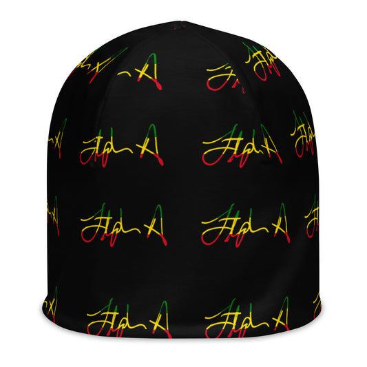A black beanie hat featuring a repeating pattern of stylized cursive script in red, yellow, and green, resembling the Rastafarian flag colors. Stephen Allen Music