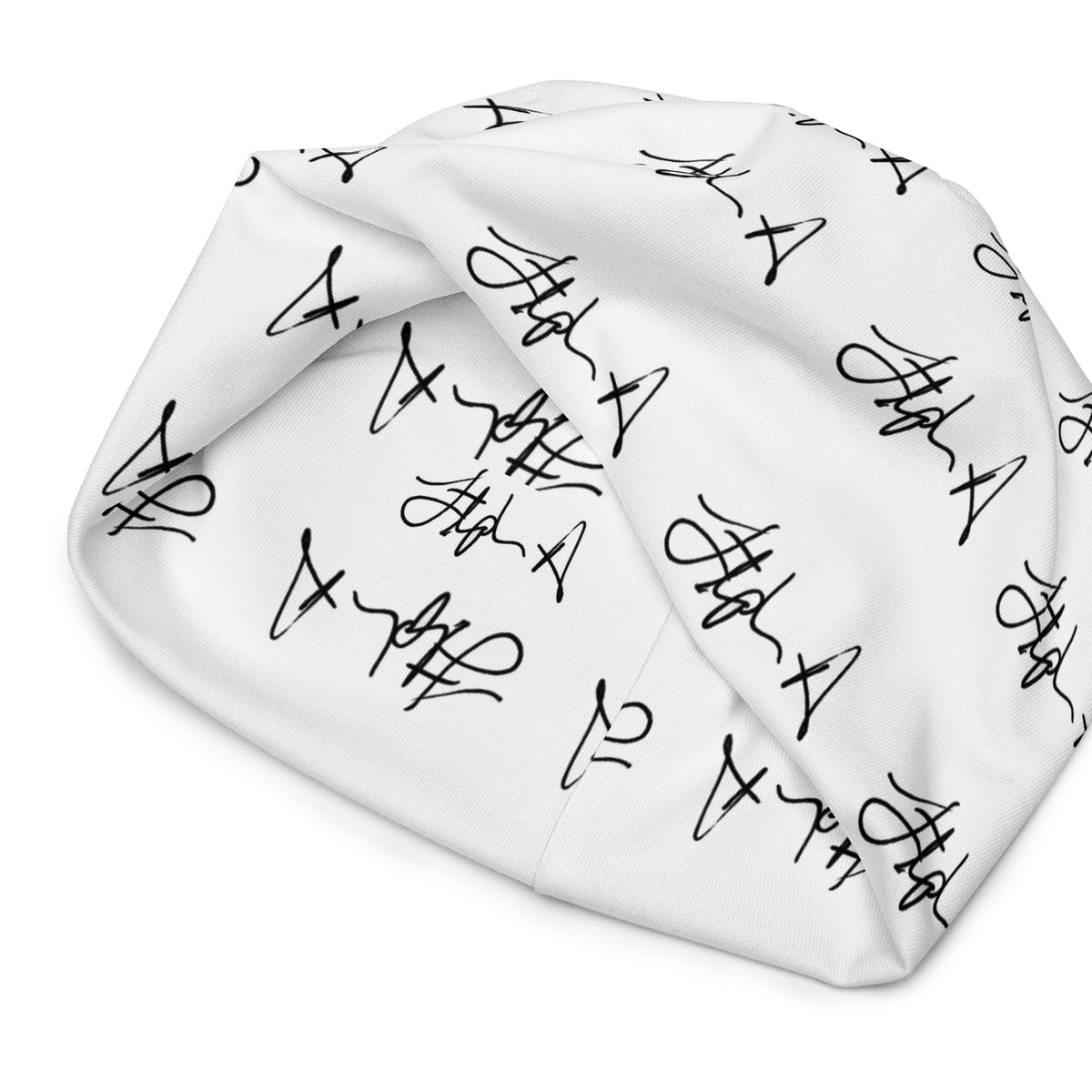 A white beanie hat featuring an all-over black script pattern, shown against a plain white background. Stephen Allen Music