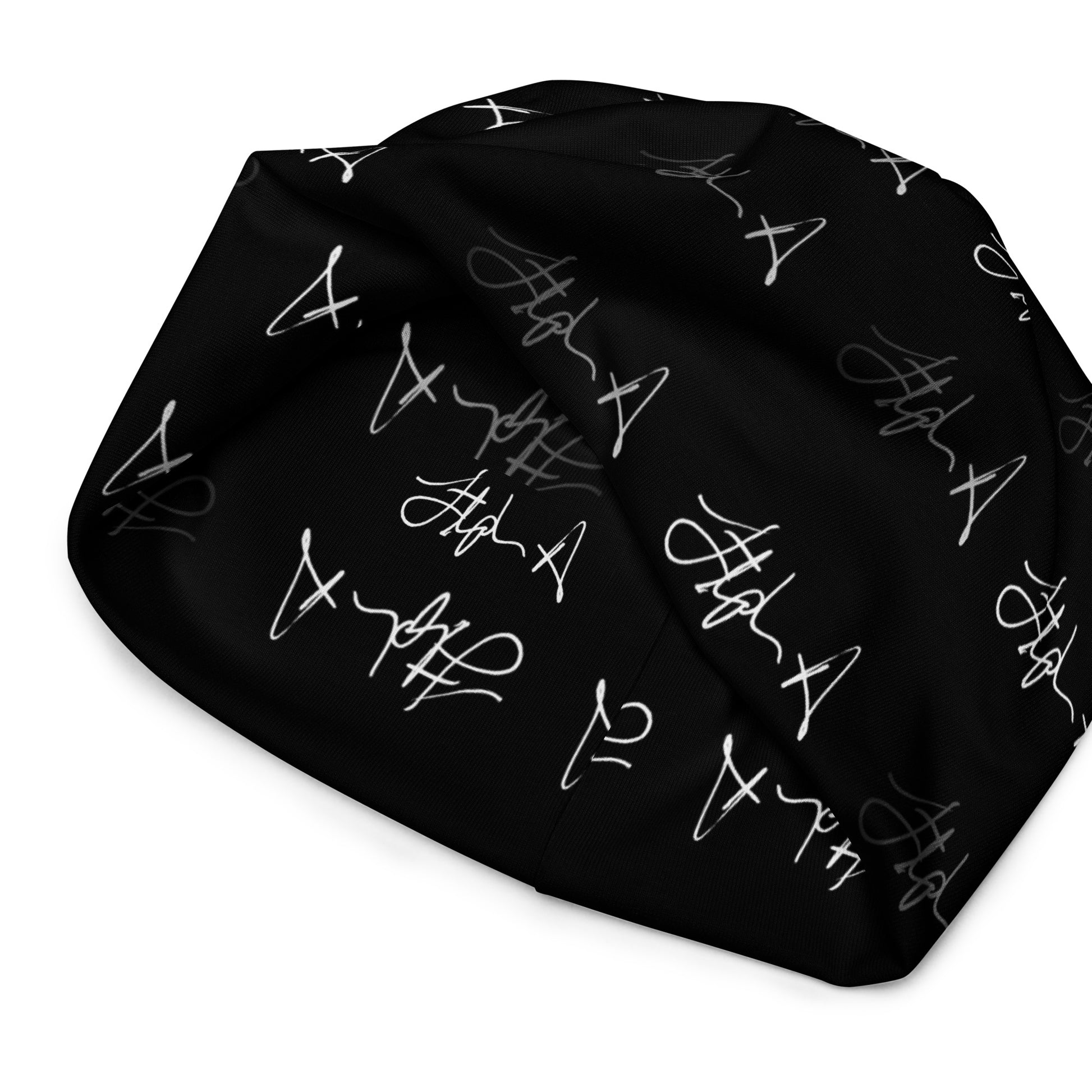 A black beanie hat featuring an all-over repeating white script logo pattern, shown against a plain white background. Stephen Allen Music