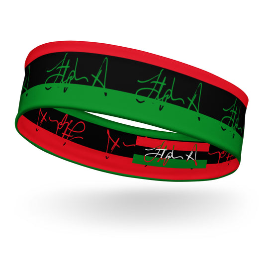 A silicone wristband featuring a black center band with green script signatures, bordered by red on the top and bottom, and a green stripe on the side, shown floating on a white background with a soft shadow. Stephen Allen Music