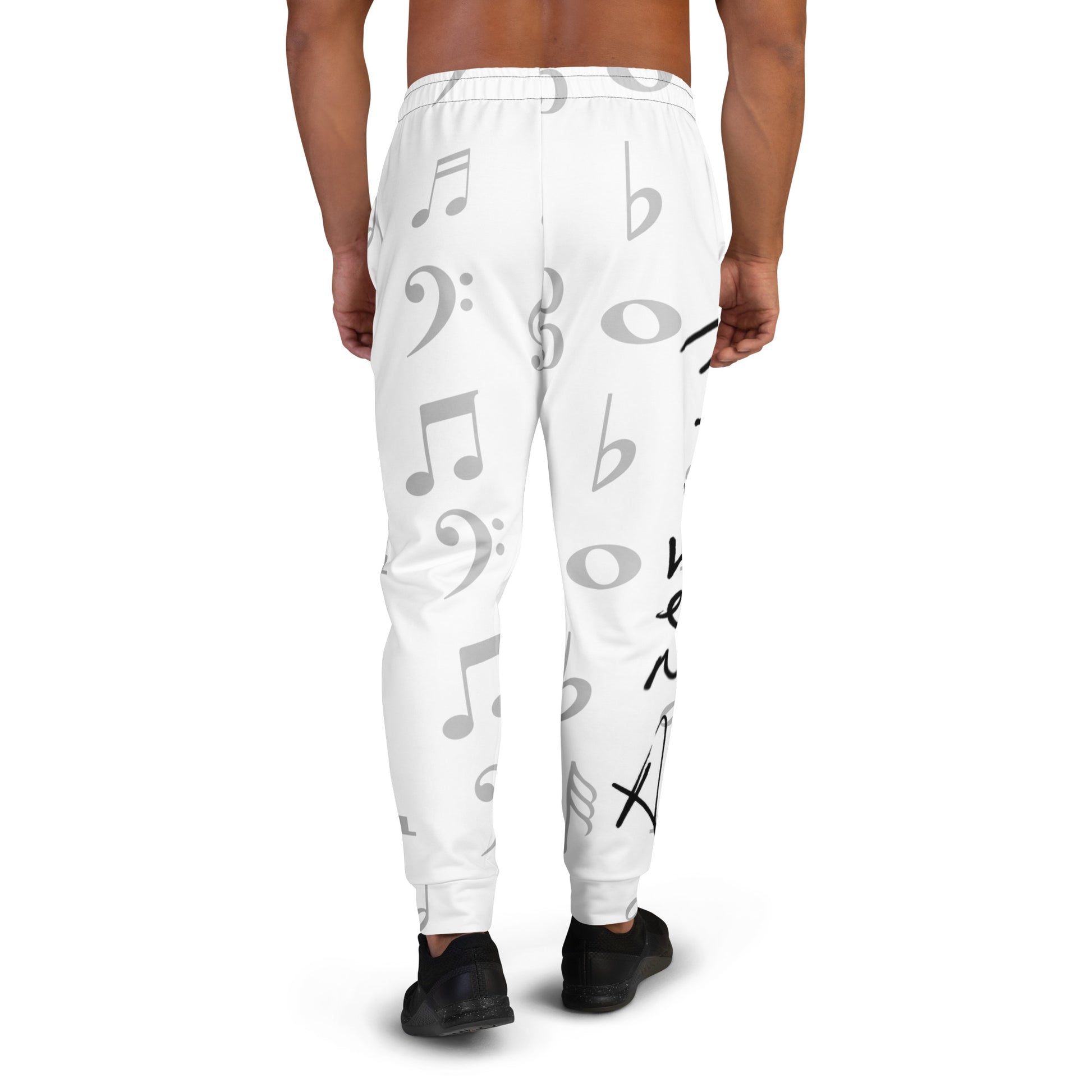 White jogger pants with black musical symbol print worn by a person on a white background Stephen Allen Music