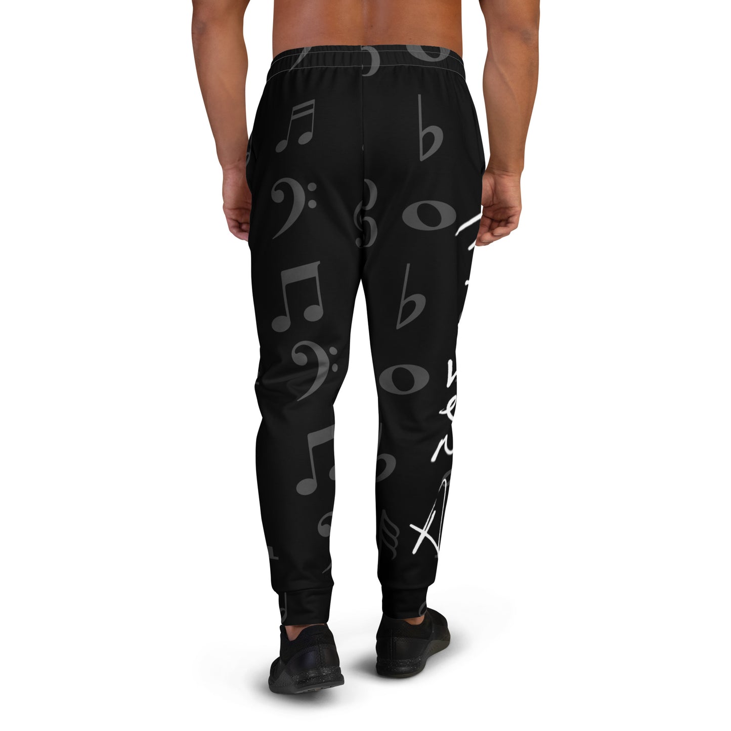 Black jogger pants with music note pattern worn by a person on a white background Stephen Allen Music