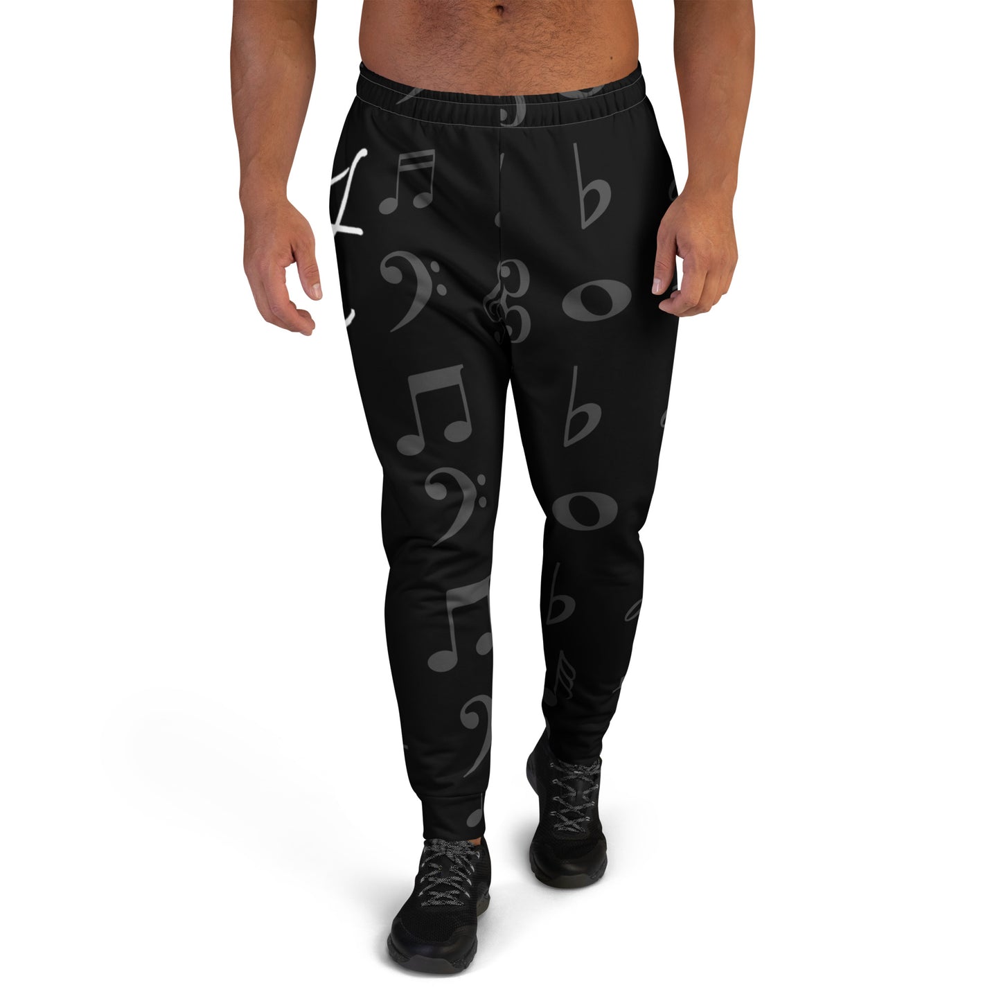 Black jogger pants with musical note pattern worn by a person on a white background Stephen Allen Music
