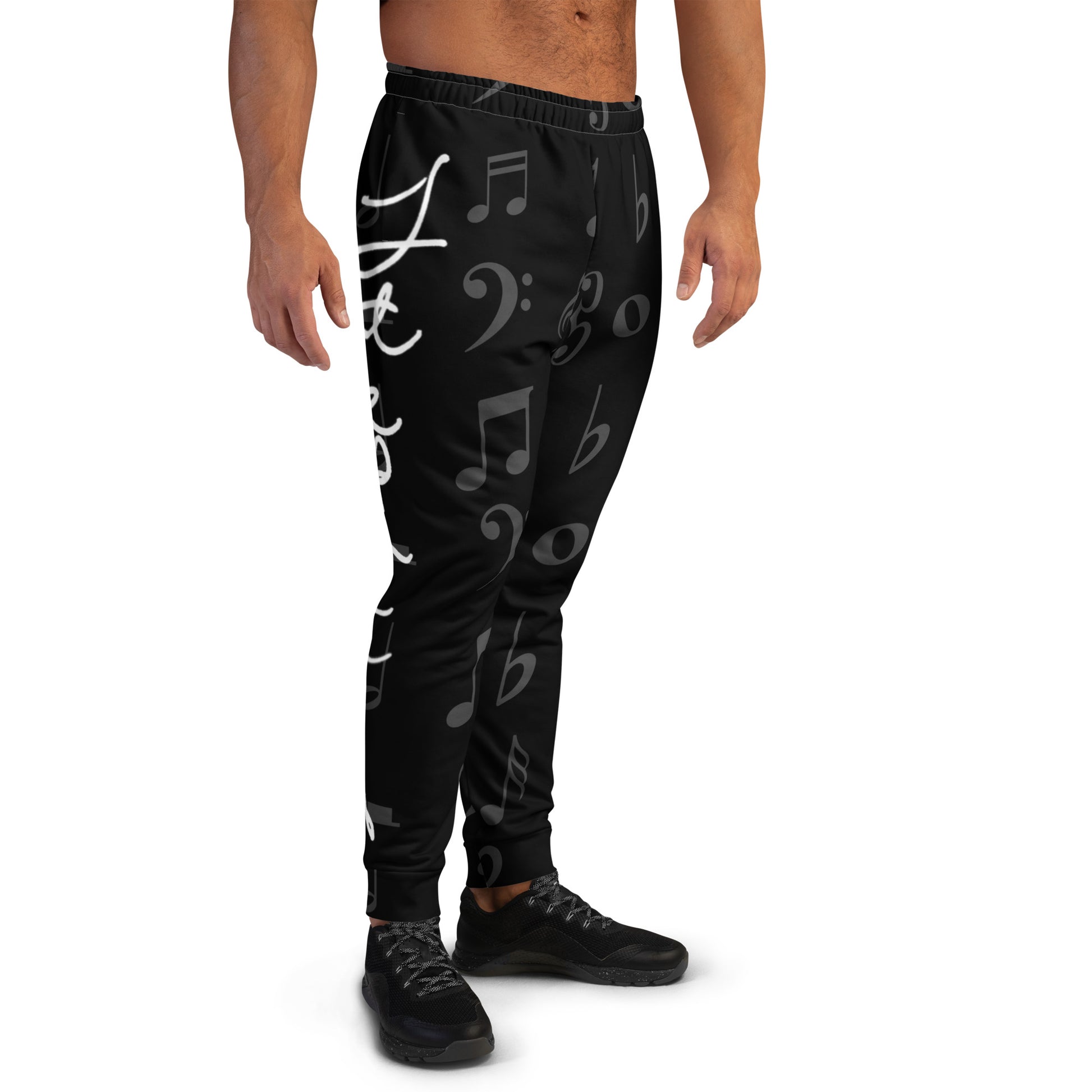 Black jogger pants with musical note pattern worn by a person on a white background Stephen Allen Music