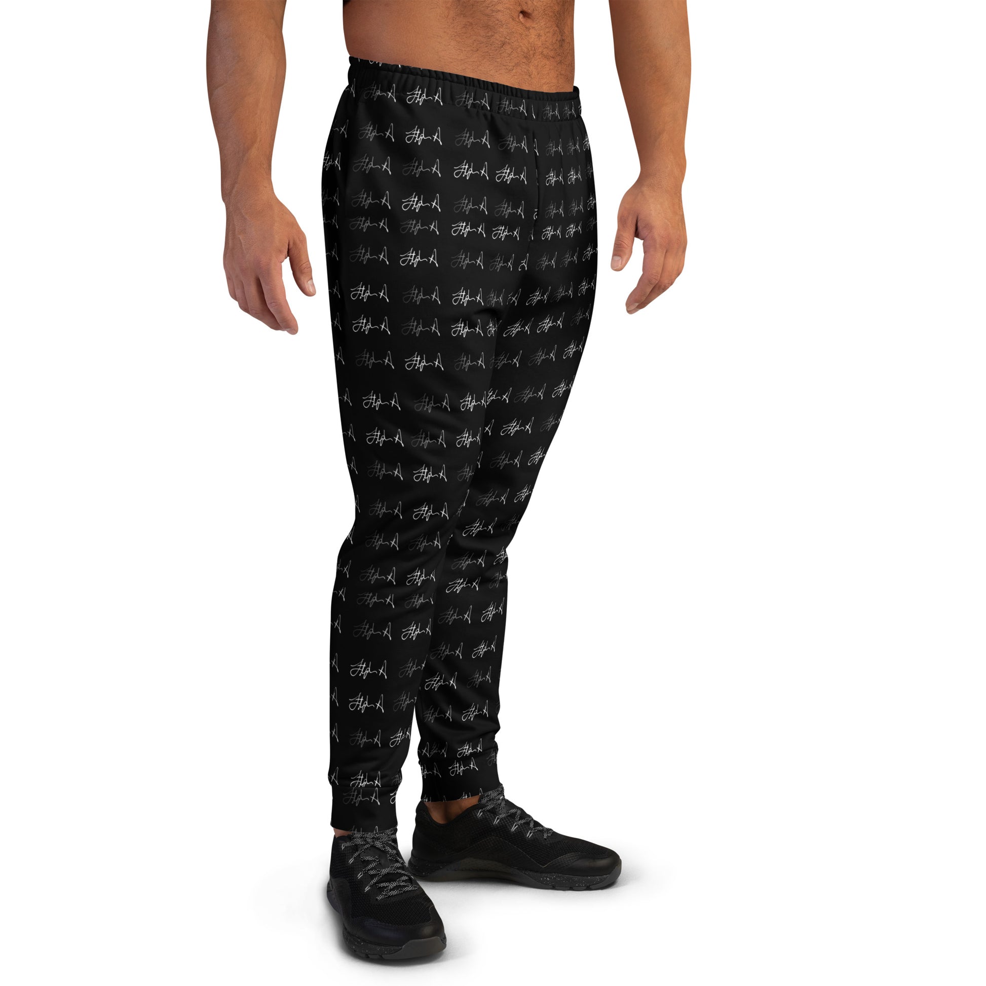 Black jogger pants with a white graffiti-style pattern, shown on a model from the back against a white background. Stephen Allen Music