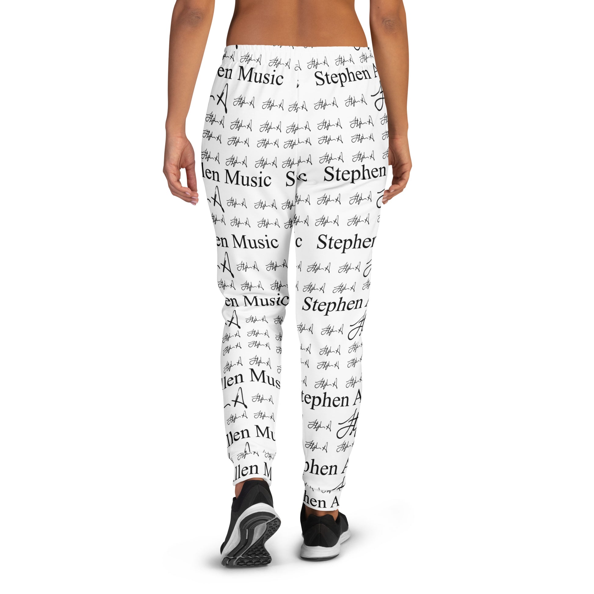 White leggings with a black repeating text and script pattern reading 'Stephen Allen Music ', shown on a model from the waist down against a plain white background.