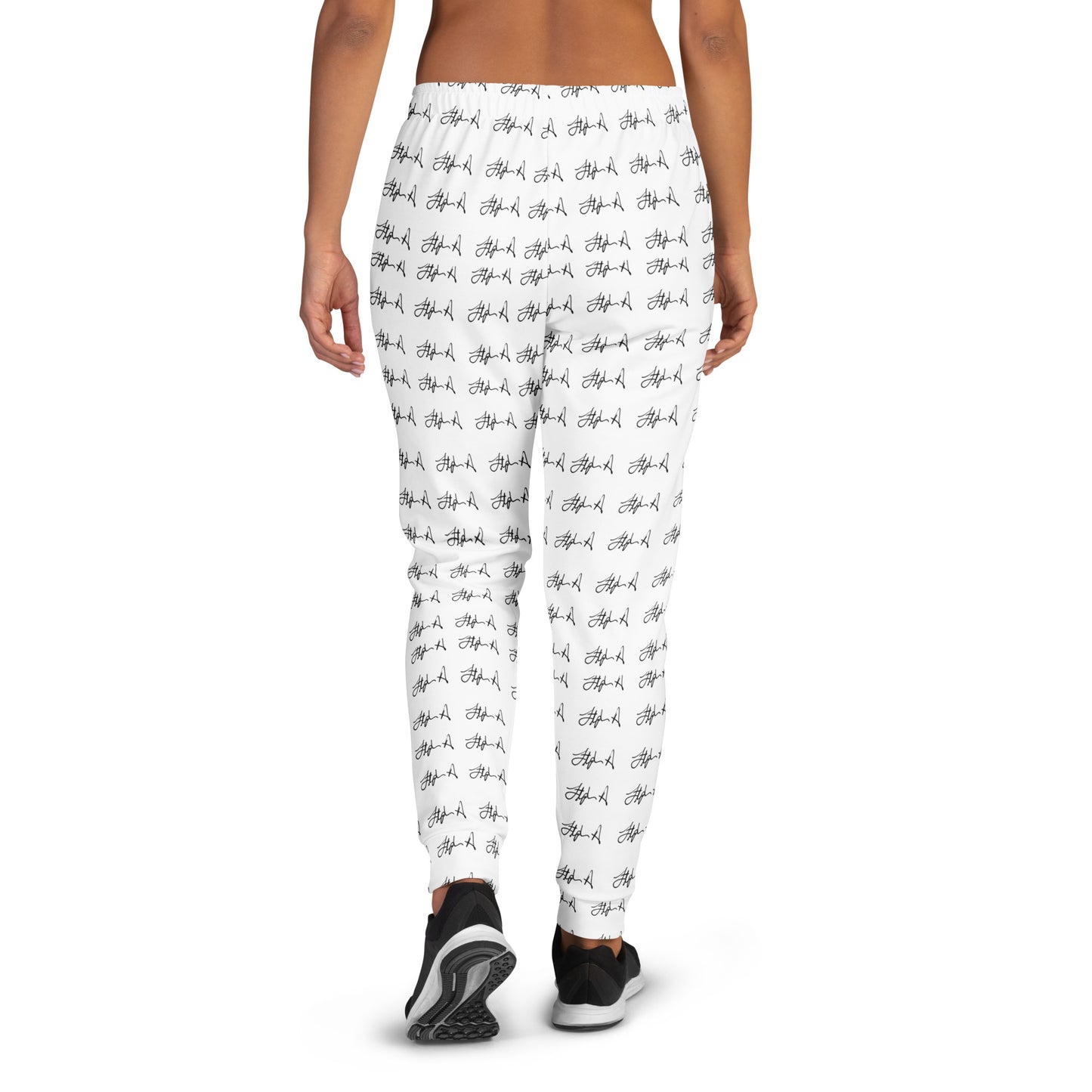 White leggings with an all-over black script pattern, shown on a model from the back against a plain white background. Stephen Allen Music