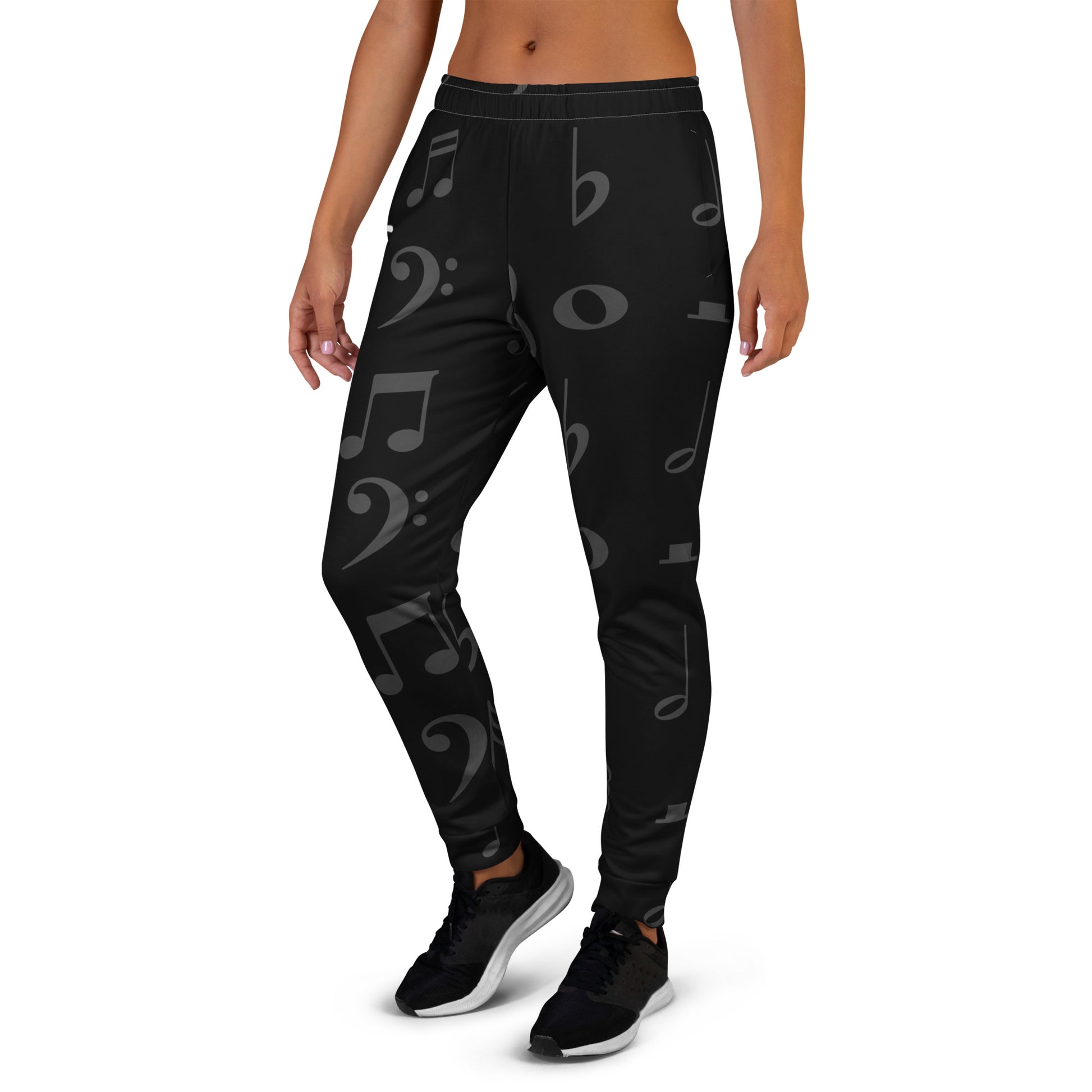 Black leggings with musical note pattern worn by a person on a white background Stephen Allen Music