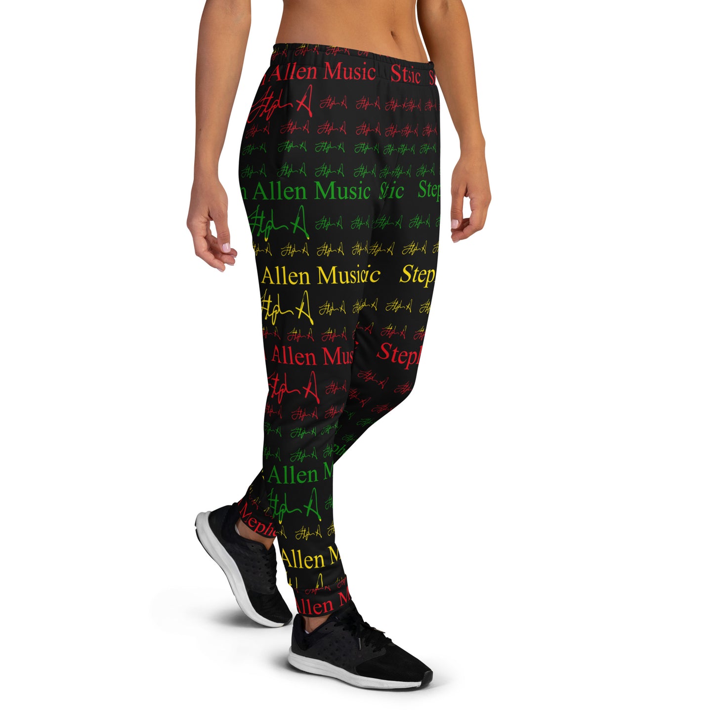 A person modeling patterned leggings against a plain white studio background. The leggings feature an all-over print of the phrase 'Stephen Allen Music' in red, green, and yellow text with repeated signature-style marks.
