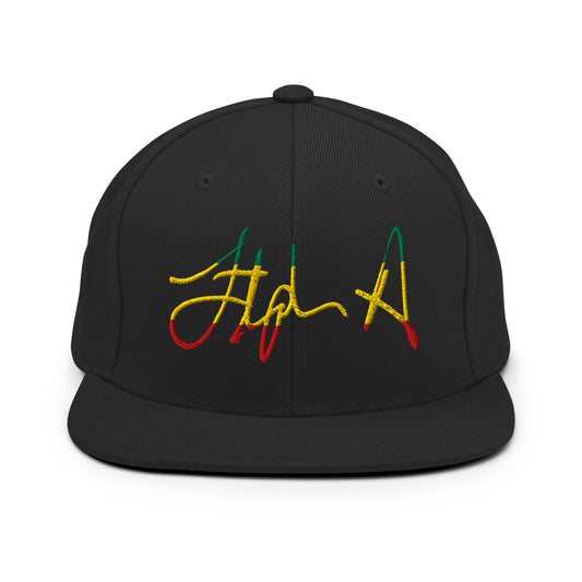 A black flat-brim baseball cap featuring a stylized embroidered signature logo in yellow, green, and red thread on the front panel, set against a plain white background. Stephen Allen Music