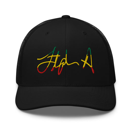 A black trucker-style cap with a curved brim and black mesh back panels, featuring a stylized embroidered script logo on the front in yellow, green, and red. Stephen Allen Music